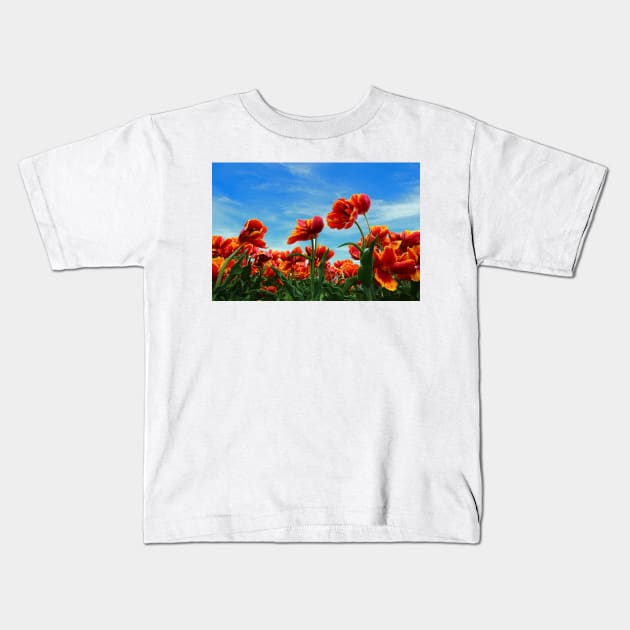 A field of Orange Tulips Kids T-Shirt by ikshvaku